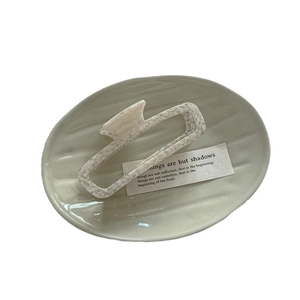 Elegant rectangle cutout hair claw clip with cream marble texture in ceramic tray