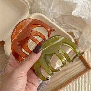 Handmade amber brown and olive green jelly hair claws for thick hair styling