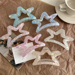 Set of colorful star-shaped hollow hair claws in translucent macabre finishes