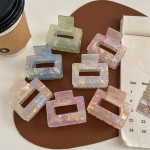 Seven-piece colorful iridescent hair claw clip set in various macabre pastel colors