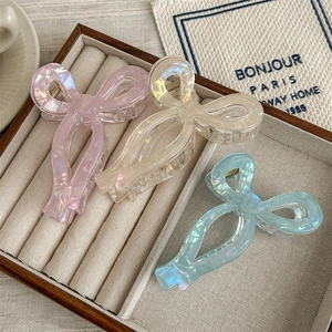 Pinces à cheveux nœud marbré en finitions rose perle, beige et bleu ciel