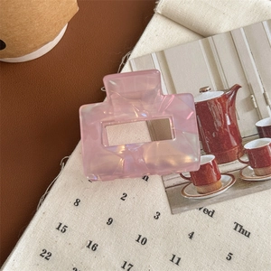 Pink marble rectangle hair claw clip on vintage aesthetic fabric calendar background