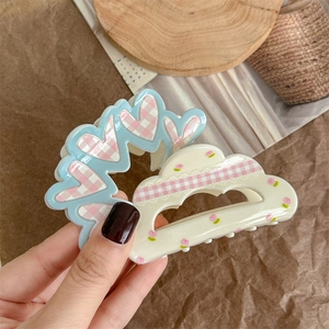 Floral and checkered acrylic hair claw clip with heart and cloud shaped elements