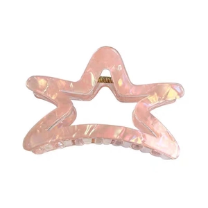 Chic iridescent pink star hair claw clip with pearlescent resin finish and golden spring