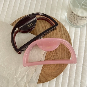 Elegant semi-circular matte hair claws in pink and chocolate tortoiseshell resin finish