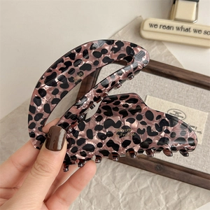 Elegant leopard print acetate hair claw clip with purple base and sturdy grip for women