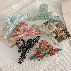 Elegant acetate hair claw clips in six assorted marble patterns for French style hair bun
