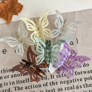 Set of six colorful butterfly hair claws in acetate finish with elegant hollow design
