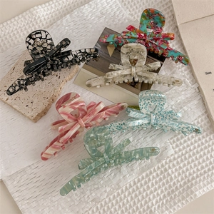 Elegant large acetic acid hair clips in diverse marble and floral patterns for thick hair