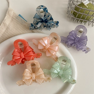 Lot de six pinces à cheveux en forme de nœud en acétate aux couleurs pastel
