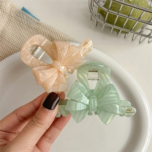 Pinces à cheveux nœud vintage en acétate aux couleurs abricot perlé et vert menthe