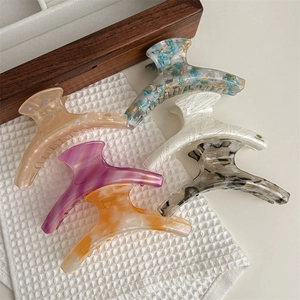 Handmade large acetate hair claw set featuring marble and wood grain textures for women