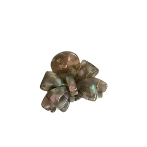 Elegant bow-shaped hair claw clip in translucent iridescent grey acetate material