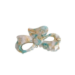 Elegante pinza per capelli in acetato con motivo marmorizzato, fiocco vintage e dettagli oro