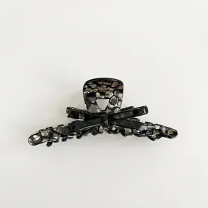 Elegant large black crystal hair claw clip with satin bow and handmade tortoiseshell finish