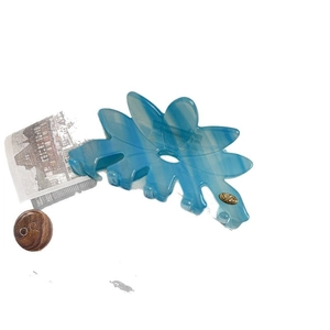 Pince à cheveux fleur motif ondes bleues avec boucle dorée et fini translucide