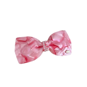 Pink marble texture bow hair clip with sparkling rhinestones and elegant gold YD logo