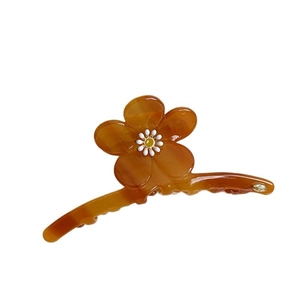 Pince à cheveux fleur en acétate ambre élégante avec centre jaune et fini poli