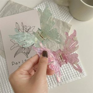 Pinces à cheveux papillon en résine rose et verte pastel avec finition pailletée