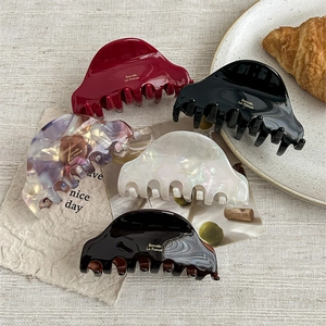 5-piece acetate hair claw clip set in assorted colors with glossy finish and logo