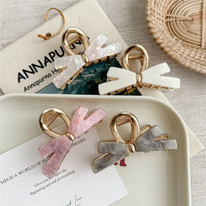 Set of 4 elegant butterfly metal hair claws in pearl white and marble textures
