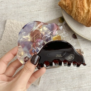 French retro acetate hair claw clips in amber and pearlescent marble finishes