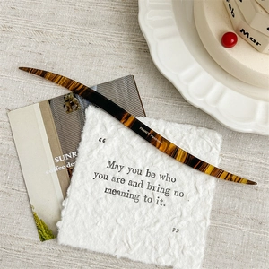 Detail of tortoise shell acetate hair stick with France Handmade engraving on body