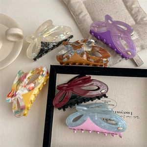 Set of six colorful acetate butterfly hair claws with elegant marble and floral patterns