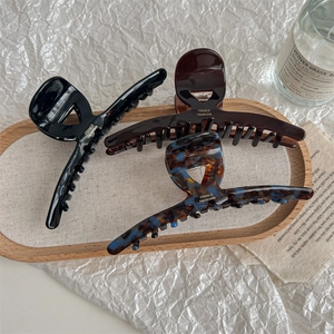 Set of large French style hair claws in black and tortoiseshell finish for thick hair