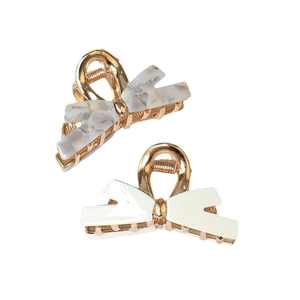 Bow-shaped gold alloy hair clips with marble pattern and cream resin finishes