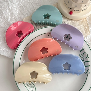 Cute macaron floral hair claw clips in assorted cream colors for elegant hair styling