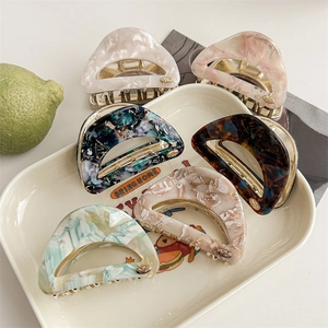 French vintage acetate triangle hair claws in multiple marble textures and colors