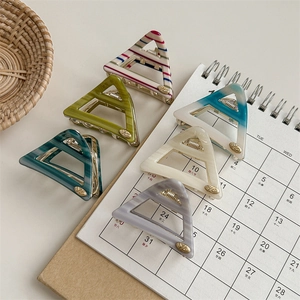 Set of 6 colorful striped and marble acetate triangle hair claws for elegant hairstyling