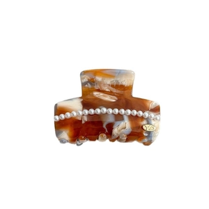 Elegant amber tortoiseshell acetate shark hair claw clip with white pearls and gold YD logo