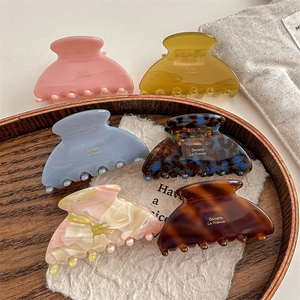 6-piece set of elegant medium acetate hair claws in various solid colors and marble patterns