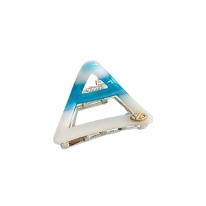 Blue and white gradient acetate triangle hair claw clip with YD logo on white background