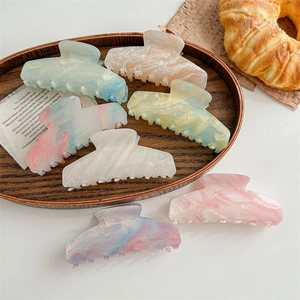 Large marble-textured acetate hair claw clips in macaron colors for women's hairstyles