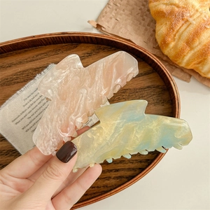 Large marble pattern hair claw clips with glitter finish for thick hair in warm ins style