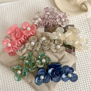 Chic acetate flower hair claws with pearl center and elegant rose detail in six colors