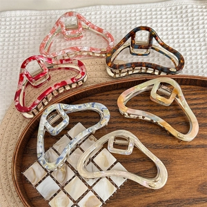 Acetate cloud hair claw clips in marble and tortoiseshell patterns for women