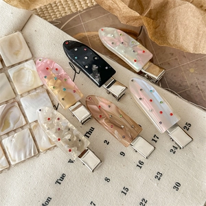 Elegant acetate duckbill hair clip set with colorful rhinestones in various marble patterns
