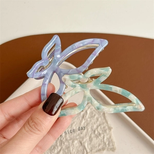 Chic marble texture butterfly hair claws in lavender and mint green colors for women