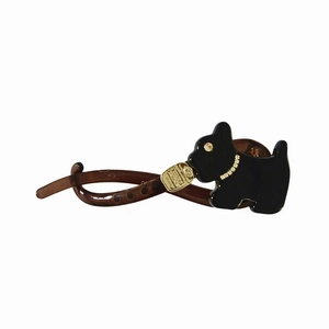 Fermaglio a banana in acetato marrone con grazioso cucciolo nero e collare di strass lucidi