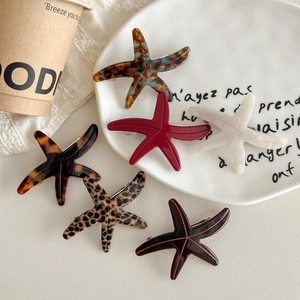 Starfish acetate hair clips in six assorted marble and tortoise patterns for women