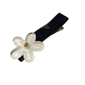 Elegant translucent white flower hair clip with amber rhinestone on deep blue base