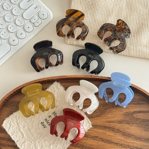 Set of 8 colorful octopus style hair claws in resin with a glossy finish for women