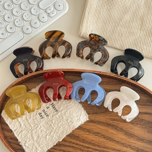 8 colors of Korean style acetate claw clips for high ponytail hair styling on a tray