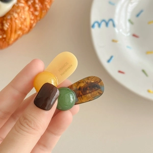 French style handmade minimalist hair clips in warm yellow and amber tortoiseshell