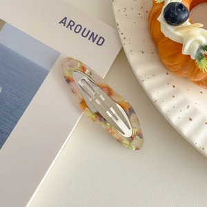 Detail of artistic oil painting cloud hair clip with metal spring clasp and marble pattern
