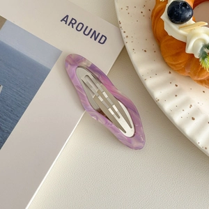 Detail of purple marble pattern acetate hair clip with elegant cloud-like oil painting texture